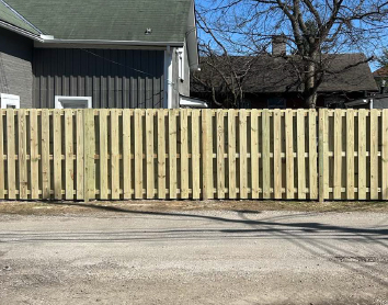 wood-privacy-fence-columbus-ohio Newly installed wood privacy fence providing backyard security and privacy for a residential property.