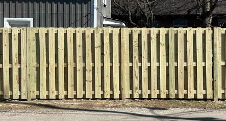 Pressure-treated wood fence offering classic residential privacy and natural appeal in Columbus, Ohio.